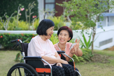 caregiver talking to a senior woman