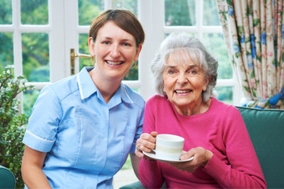 senior woman having a tea while smiling